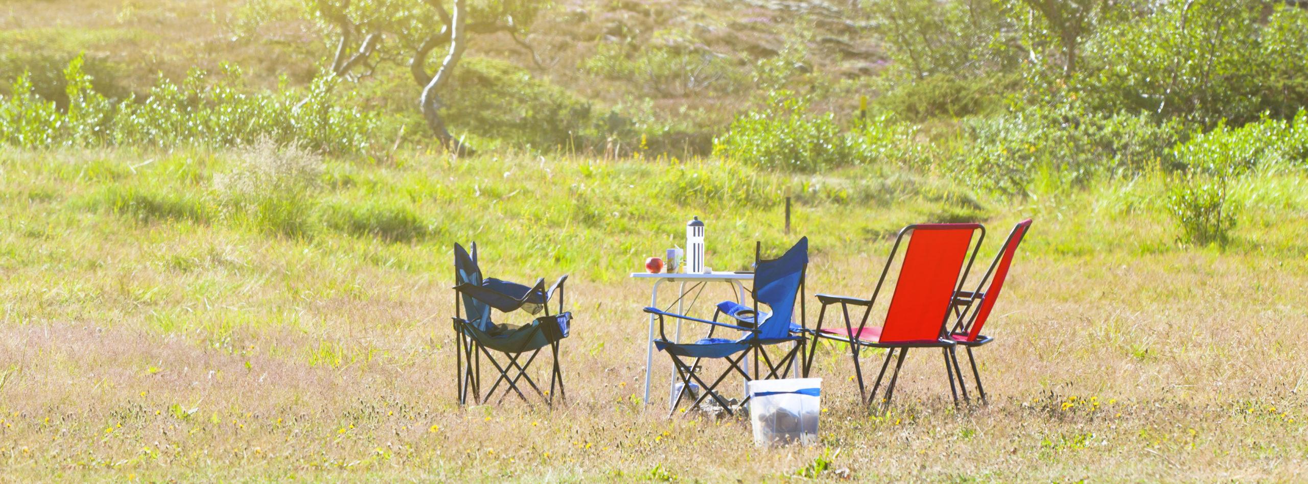 Camping site with camp-chairs and table